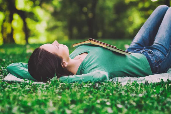 depositphotos_69536561-stock-photo-woman-lying-down-in-natur